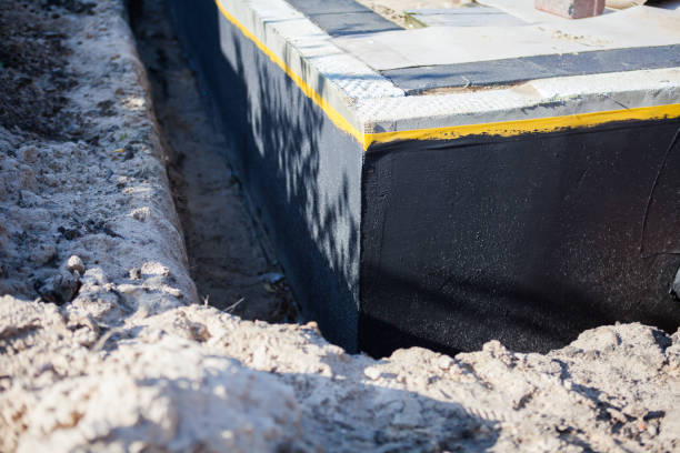 Professional Waterproofing technician working in Vienna, VA
